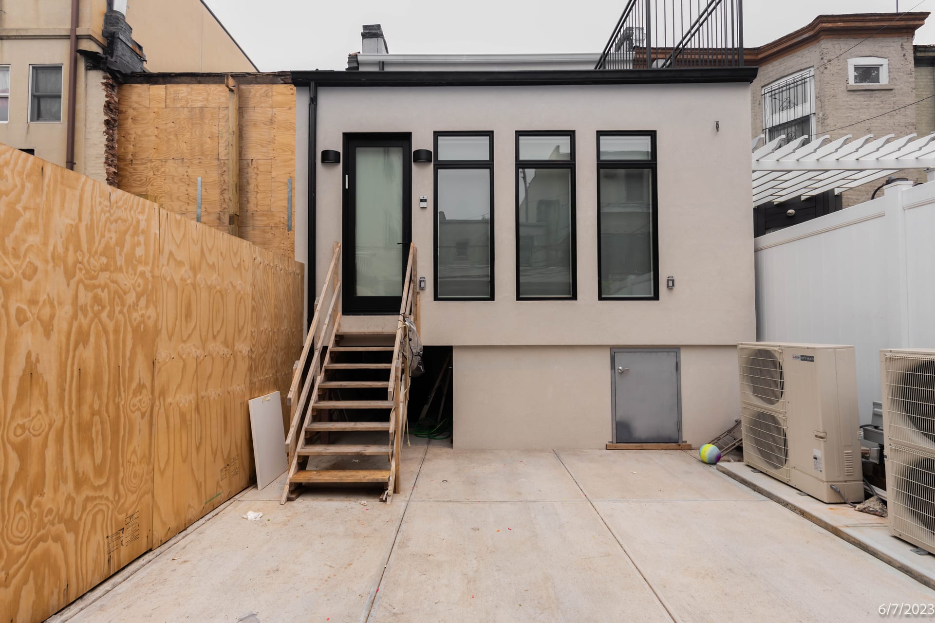 Rear exterior stair and AC unit re-documented in an OpenDoors360 post construction survey in New York City, compared against the pre-construction baseline.
